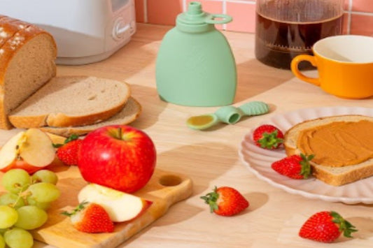 A bright breakfast scene with fruit, toast, and the Palmetto Pouch—ideal for kids’ smoothies on busy mornings.